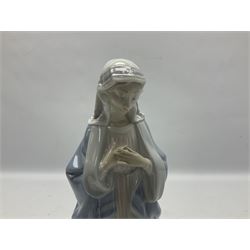 Lladro figure, Holy Night, modelled as Mary kneeling over baby Jesus, sculpted by Vincente Martinez, with original box, no 5796, year issued 1991, year retired 1994, H22cm