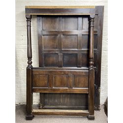 17th century style oak 4' four poster bed, high panelled back with projecting canopy cornice and panelled roof, turned posts with panelled front