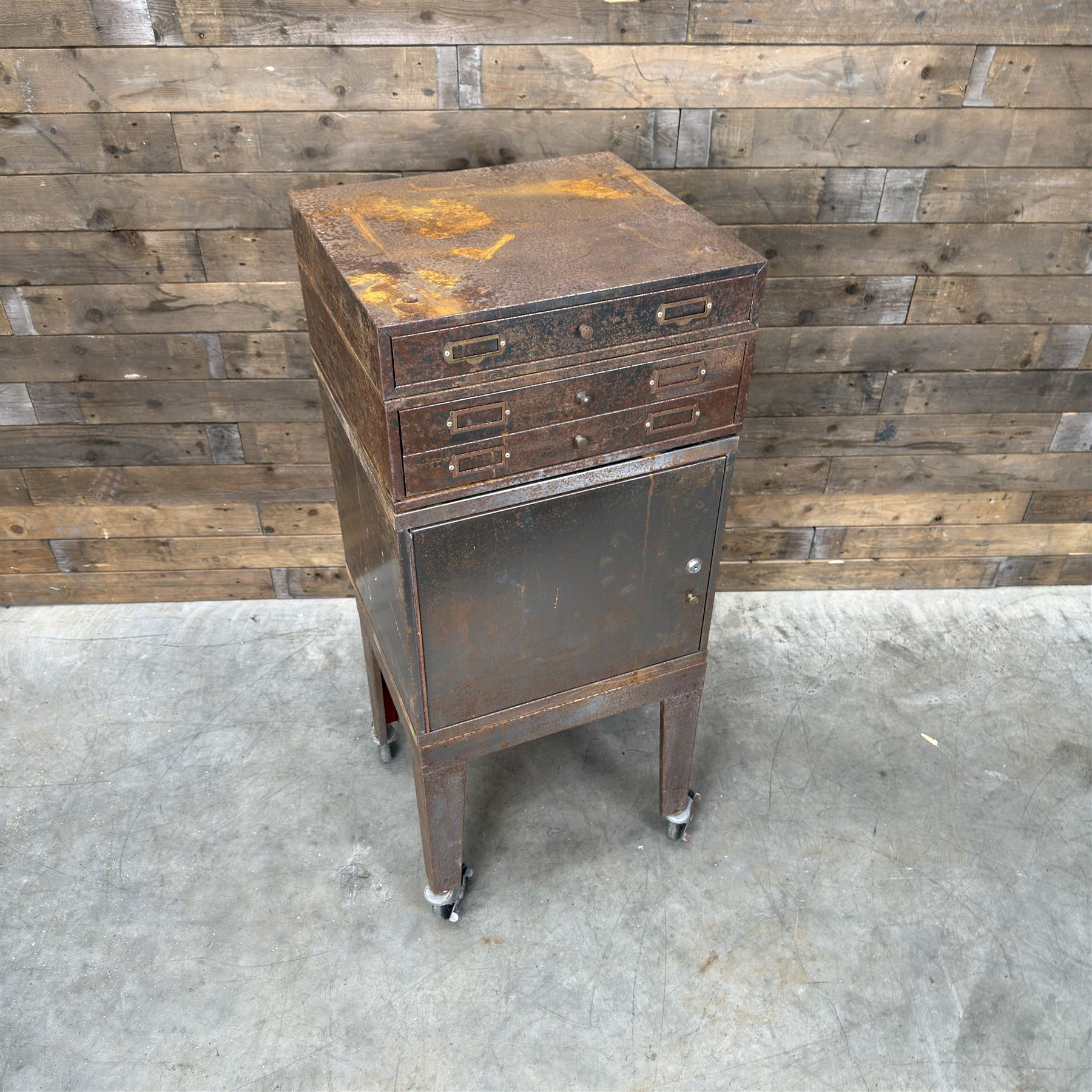 Luxor - industrial modular cabinet, three sections comprising single drawer, double drawer and single cupboard, raised on stand; and a tall industrial cabinet