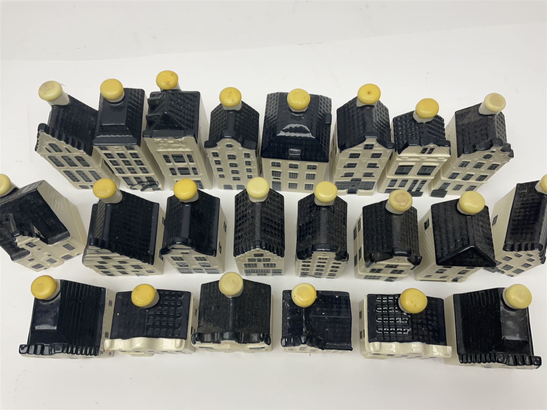 Twenty seven KLM Bols Blue Delft's decanters in the form of Dutch houses, some with contents