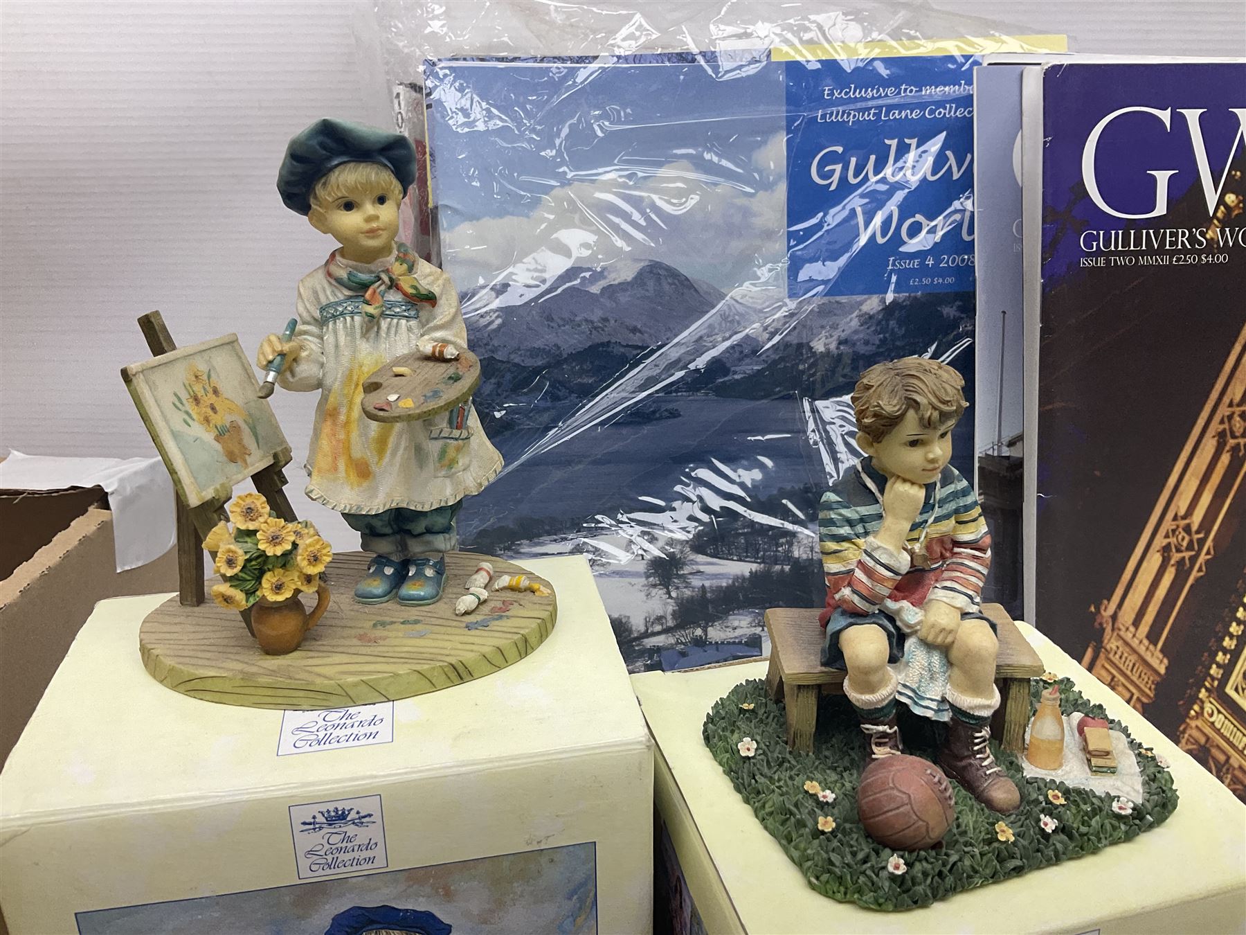 Twenty three Lilliput Lanes, including Village School, Lace's Shoe Shop, Cockles & Muscles, Scotland the Brave etc, together with The Leonardo Collection Paint Box Poppets and Gullivers World magazines 