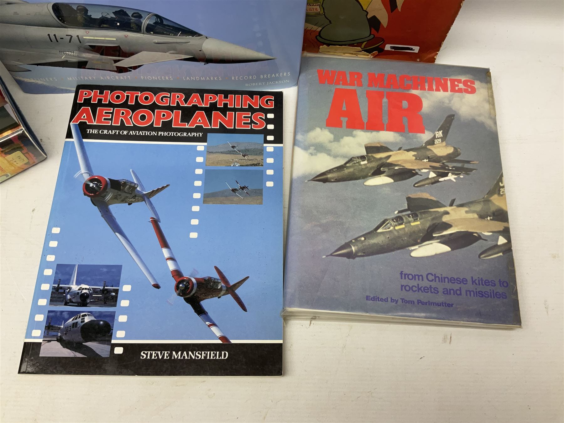 Ten books of predominantly military aircraft interest including Aircraft Anatomy World War Two, Hurricane Messerschmitt, The Avro Lancaster, The Luftwaffe Album, Encyclopaedia of Aircraft of WWII etc; together with a scrap album of WW2 newspaper cuttings