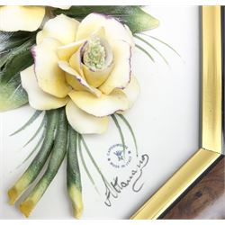 Set of three Capodimonte wall plaques, depicting floral decoration in octagonal frames with gilt edging, largest plaque H48, two small plaques H31cm.    