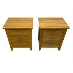 Pair of light oak three drawer bedside chests