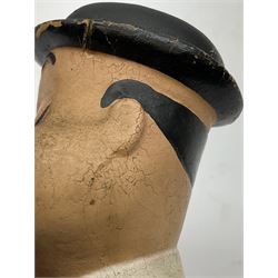 Mid-20th century composition bust of Oliver Hardy depicted smiling with eyes closed and wearing a top hat H11.5cm