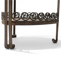Art Nouveau wrought metal and specimen marble two-tier occasional table, the triangular marble top raised on strap metal uprights with scroll capitals, the under-tier with raised Vitruvian scroll design gallery