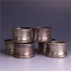 Six early 20th century French silver napkin rings, each with engraved initials, stamped with Minerva mark for 950 standard silver and maker's mark for Claude Doutre Roussel 