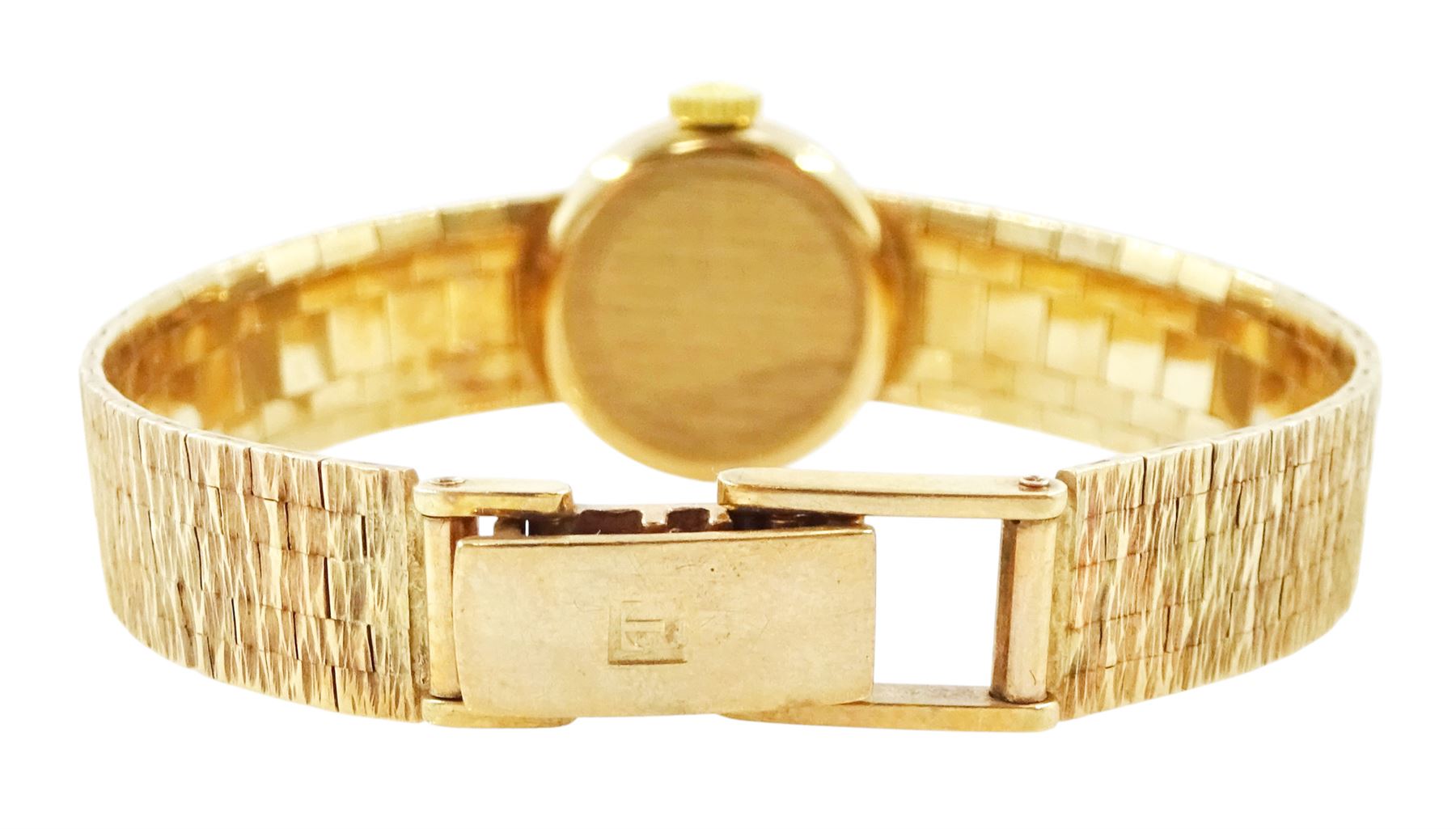 Tissot ladies 9ct gold manual wind wristwatch, silvered dial with baton hour markers, London 1973, on integral 9ct gold bracelet