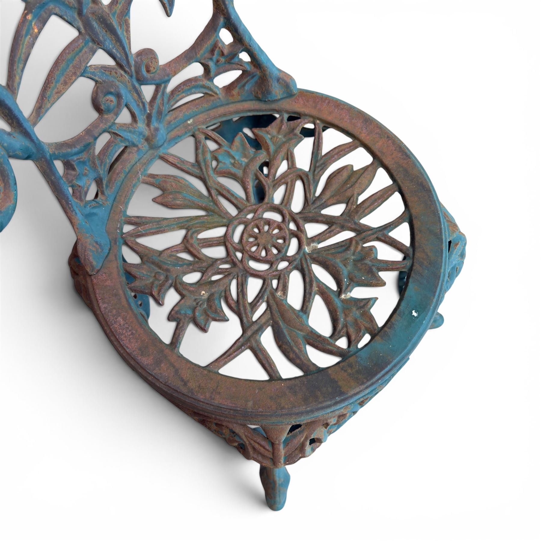 Cast iron garden table and four chairs, in the Art Nouveau style, with pierced floral and foliate decoration throughout, circular table raised on four cabriole legs with stretcher ring, chairs with shaped openwork backs and seats, in a weathered green finish