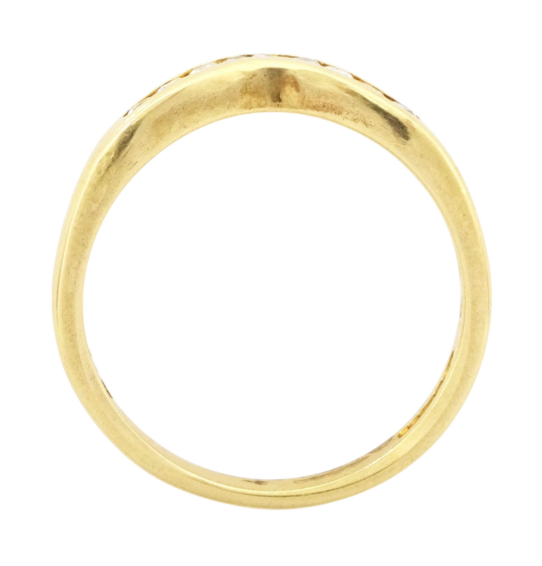 18ct gold diamond wishbone ring, channel set with nine round brilliant cut diamonds, Birmingham 1994, total diamond weight 0.15 carat
