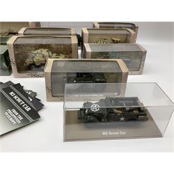 Sixteen Atlas Editions die-cast models of military vehicles including six Ultimate Tank Collection; all in perspex display cases; fourteen boxed; with associated paperwork (16)