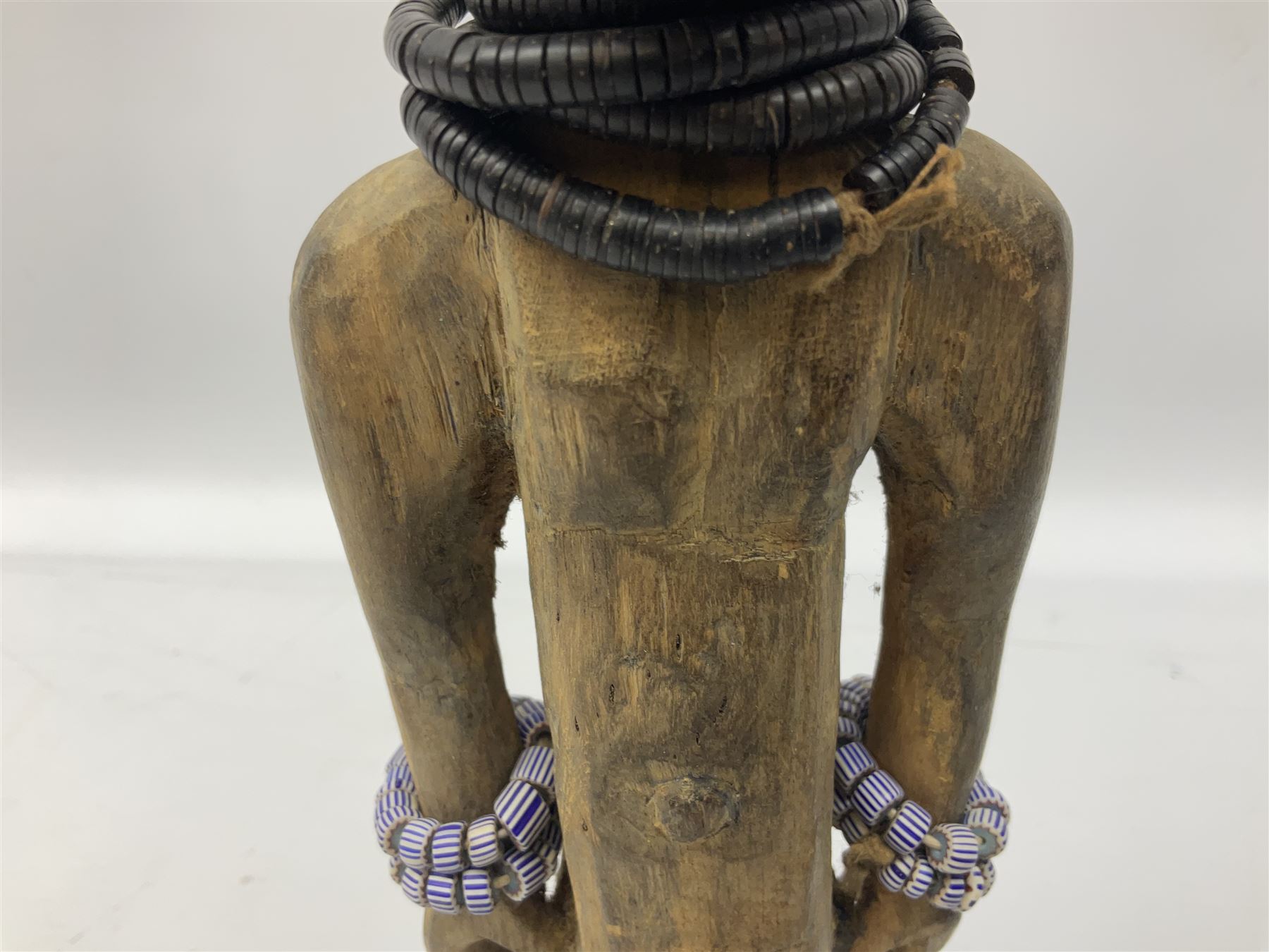 Early 20th century West African Yoruba family wooden figure of Orisha Oko, the god of farming/agriculture, carved from the solid, bears manuscript label of provenance verso H26.5cm