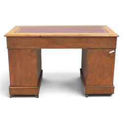 Victorian mahogany twin pedestal desk, rectangular top with red tooled leather writing surface with three frieze drawers, each pedestal with three drawers and castors
