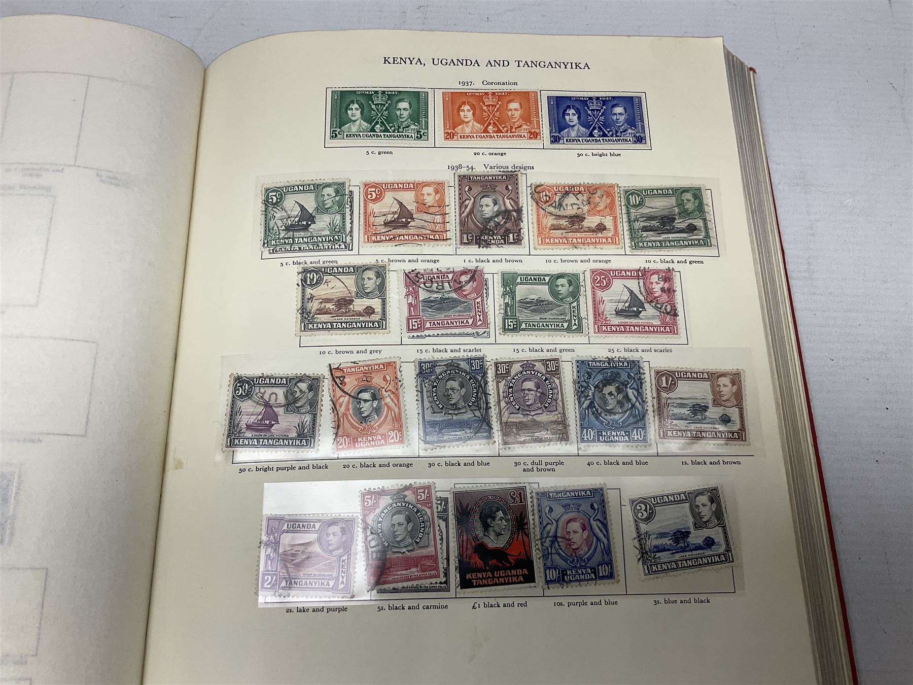 Single album collection of King George VI stamps, including Aden, Antigua, Ascension, Australia, Bahamas, Bahrain, Barbados, Basutoland, Bechuanaland, Bermuda, British Solomon Islands, Brunei, Burma, Cayman Islands, Dominica, Falkland Islands, Gambia, Gilbert and Ellice Islands, Gold Coast, Great Britain 1939-48 set to one pound including ten shilling dark blue, Grenada, Hong Kong, India, Ireland, Jamaica, Leeward Islands, Malta, Mauritius, New Zealand etc