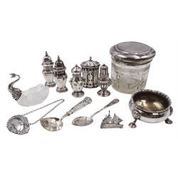 Group of silver, to include Edwardian silver open salt, of circular bellied form, with gadrooned rim, upon three shell feet, hallmarked Mappin & Webb Ltd, London 1906, together with a blank decanter label, repousse decorated with fruiting vines, hallmarked W I Broadway & Co, Birmingham 1995 and five silver pepper shakers, all hallmarked with various dates and makers, etc 