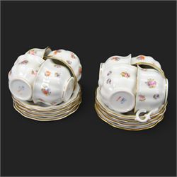 Forstenberg part tea and dinner service, comprising teapot, teacups and saucers, dinner plates, tureens, sauce boat, lidded sugar bowl, side plates and serving plates, all decorated with polychrome floral sprigs on a white ground with gilt edging