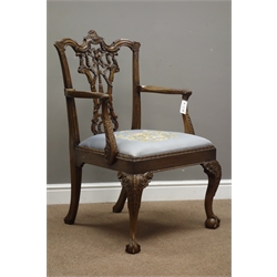  Fine 20th century Chippendale style armchair, shaped cresting rail above pierced ribbon tied carved splat, acanthus leaf carved arm terminals and supports, upholstered drop in seat with floral and scroll needlework cover, acanthus carved cabriole supports with ball and claw feet  