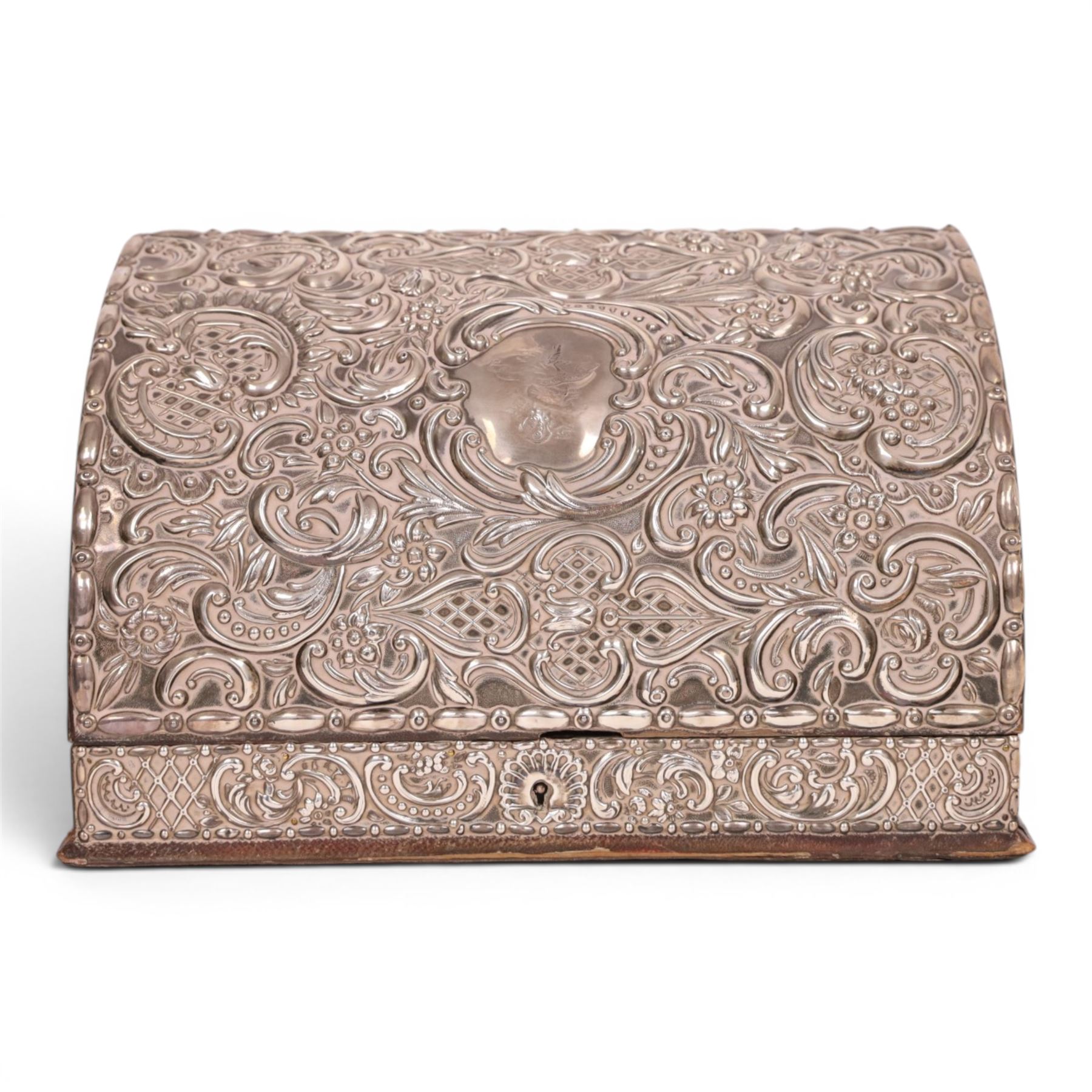 Victorian silver mounted leather stationary box, embossed with floral and scrolling decoration and engraved family crest to centre, hallmarked William Comyns & Sons, London 1877, H19cm, W29cm