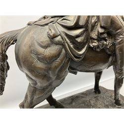 Large and impressive bronze figure of Wellington seated on a horse, on a sarcophogus shaped stepped base impressed 'Meunier Paris', the canted corners inset with battle trophies H68cm L50cm D22cm
