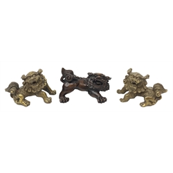 Japanese Meiji period boxwood Lion Dog, signed, L6cm, together with a similar bronze pair, (3)  
