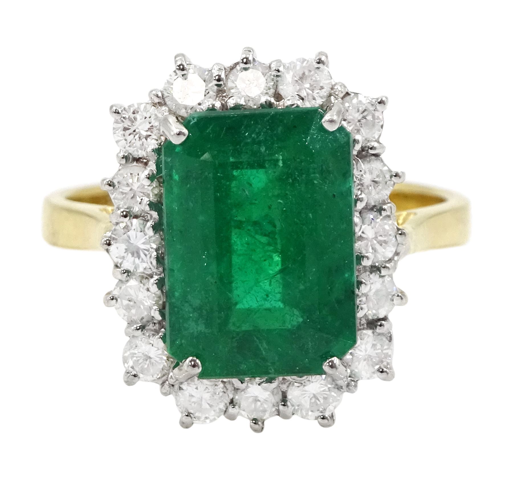 18ct gold emerald and diamond cluster ring, single octagonal cut emerald of approx 3.80 carat, with round brilliant cut diamond surround, hallmarked, total diamond weight approx 0.50 carat