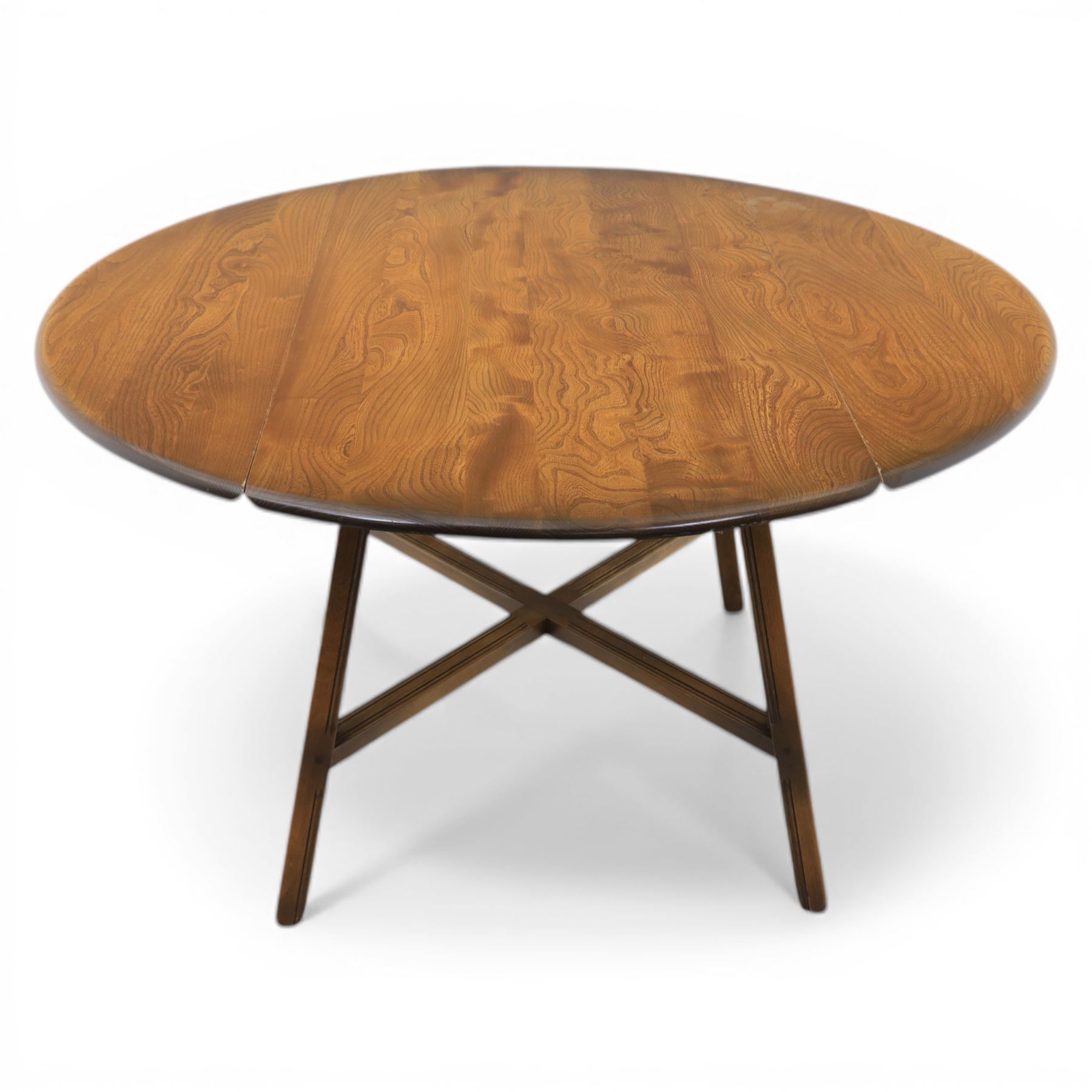 Ercol - elm oval drop leaf table, the oval moulded top with twin hinged leaves, supported on tapering legs with double stretchers (Extends to 124cm)