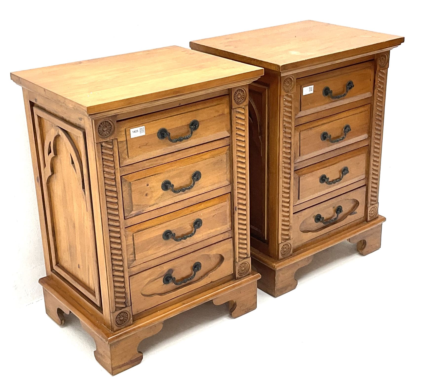 Gothic pine bedside chests, four graduating drawers, rope twist carving, shaped bracket supports 
