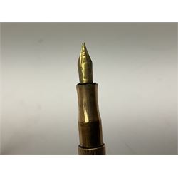 9ct gold cased fountain pen, the plain cylindrical body with personal engraving, hallmarks partly worn and indistinct 