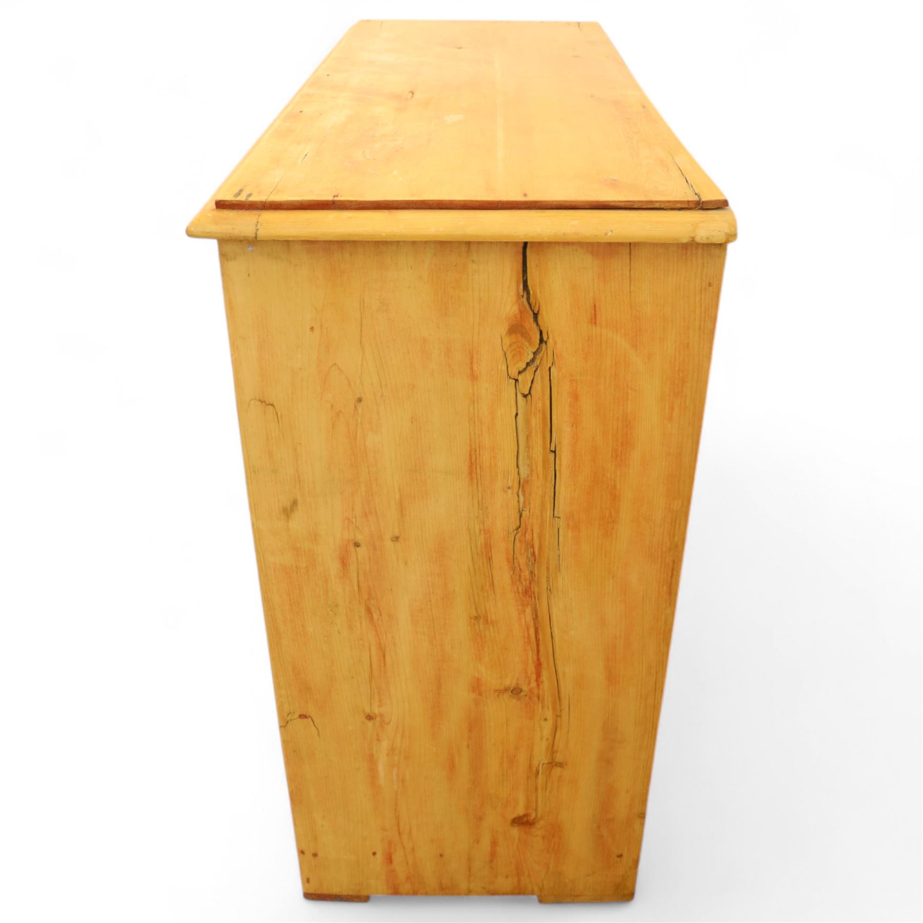 Victorian stripped pine chest, fitted with two short and three long drawers, turned wooden handles, shaped lower apron on bracket feet