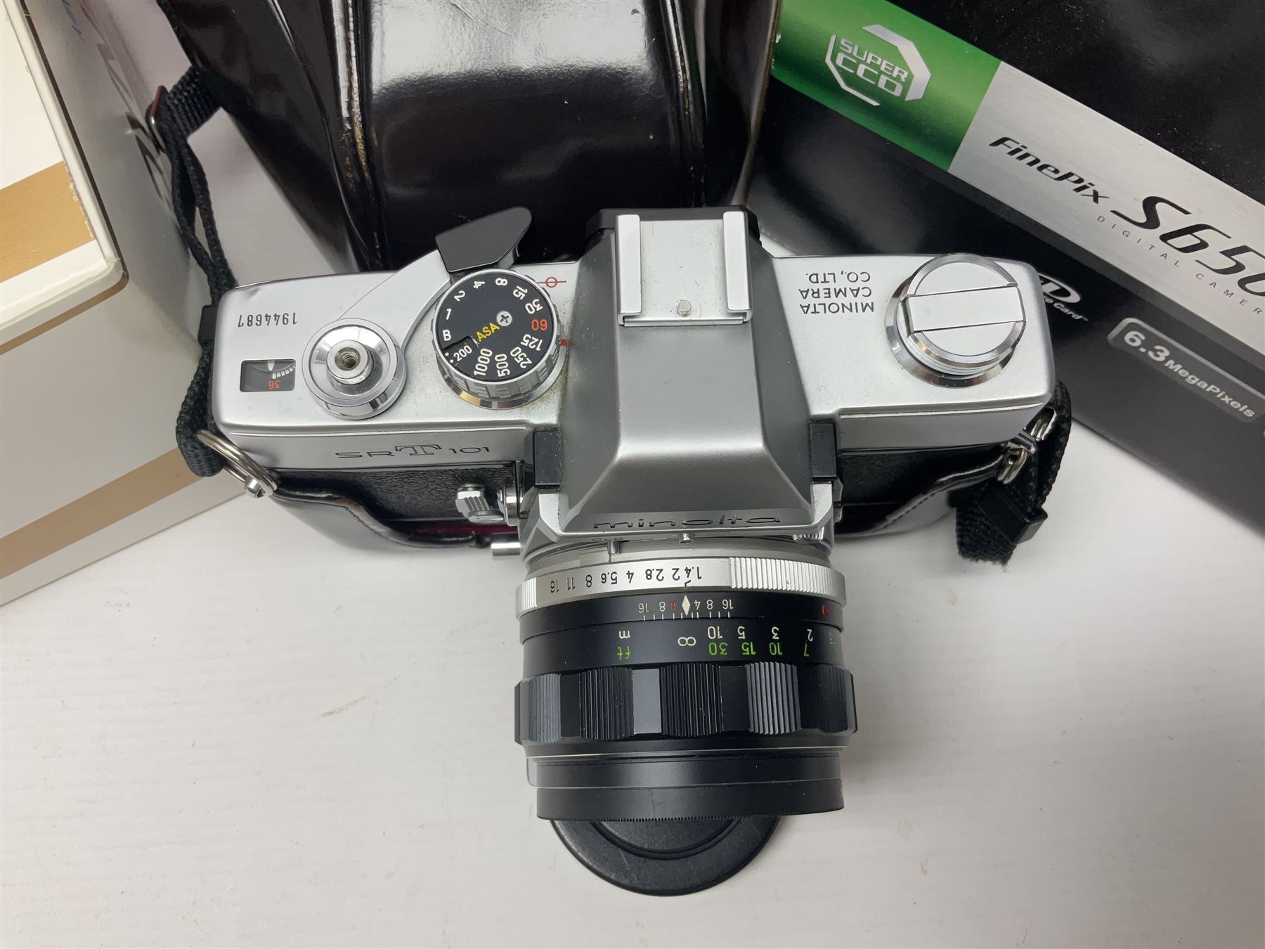 Minolta Dynax 5xi camera body serial no 17222646 with 'AF Zoom Xi 28-80mm 1:4(22)-56' lens serial no 17220881, Minolta SRT101 camera body serial 1944687, Lumix camera body serial no K6SC10168 etc 