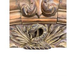 19th century carved pine architectural pediment, detailing floral swags with berries and central serpentine snake head 