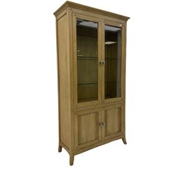 Windsor by Mark Devany oak display cabinet, with two glazed doors and two cupboards, bevelled glass doors, illuminated interior