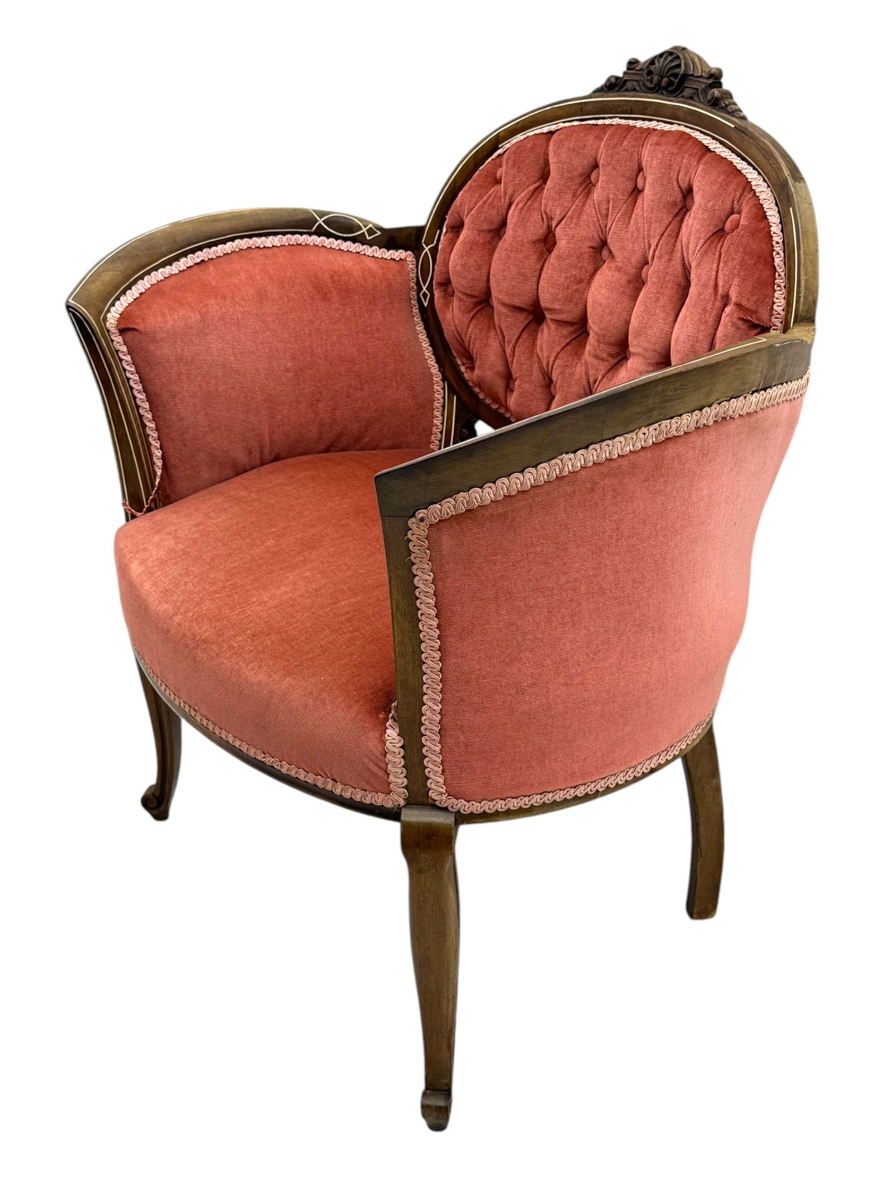Edwardian inlaid rosewood parlour suite, comprising pair of tub shaped armchairs (W77cm, D69cm, H88cm); and matching two-seat sofa (W112cm, D69cm, H88cm), each with carved crest rails with shell motifs, deep button-tufted oval backs upholstered in pink fabric with braid trim, on cabriole supports