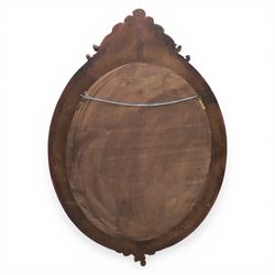 Rococo Revival style gilt composition oval wall mirror, moulded oval frame with fluted and beaded bands enclosing a bevelled mirror plate, the outer frame with acanthus leaf and scroll carved cresting to each side