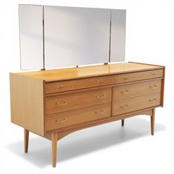 Golden Key By Palatial Ltd - mid-20th century teak dresser, three part mirror above a rectangular top, with six drawers with brass handles and pulls, upon splayed tapering legs 