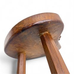 Mouseman - oak three-legged calf stool, kidney-shaped seat carved with the signature mouse motif, by the workshop of Robert Thompson, Kilburn