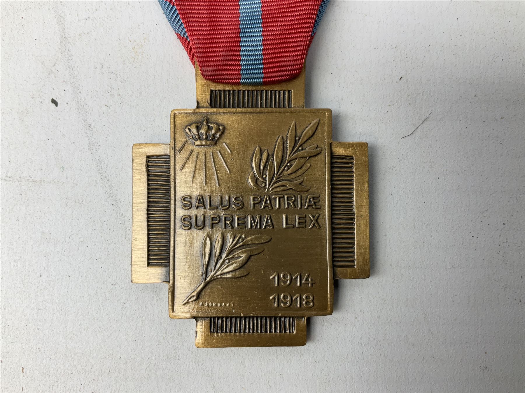 Five continental medals - WW1 Belgian Cross of Fire; WW1 French Croix De Guerre; French Croix De Combattant; French Republic Workers silver merit awarded to L. Mounet 1950; and boxed French Palmes Universitaires Officier d'Academie silver and enamel wreath (5)