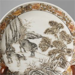 Chinese Yongzheng period saucer, finely painted in grisaille with buffalo within a rocky landscape, the inner rim with iron red and gilt foliate band, D11.5cm