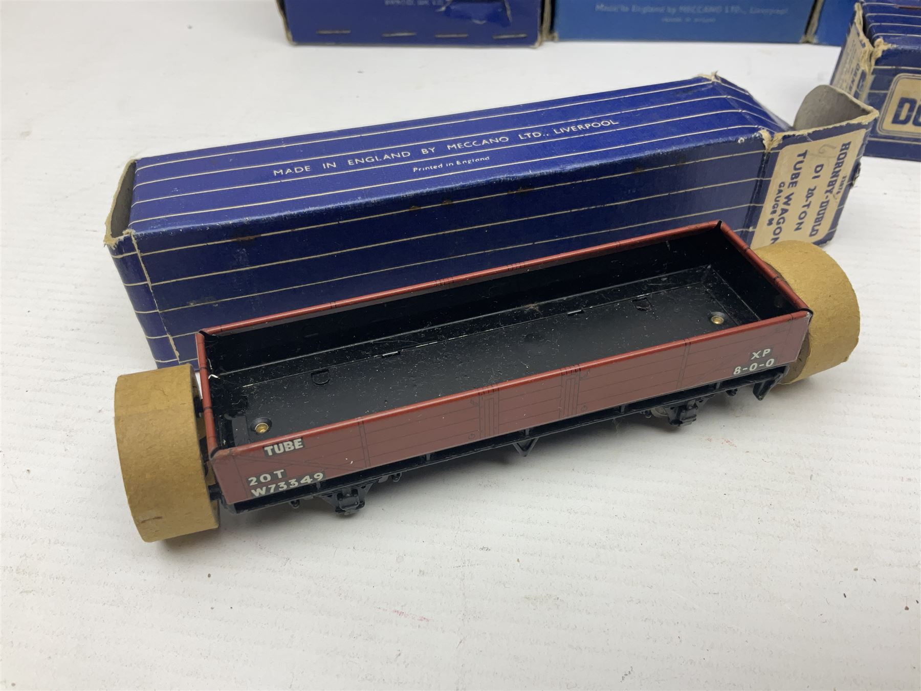 Hornby Dublo - nineteen goods wagons comprising 32040 Goods Van D1 (SR) in LMS stickered box, DR375 Goods Van D1 (GW), D303 Open Goods Wagon D1 (GW), 32044, 32076, 32052, 32021, 32074, 32056, 32065, DR379, 32070, 32020, DR373, two x 32075, High Sided Wagon D2 (LMS) in NE stickered box; all boxed; Tank Wagon D1 (Esso) and DR380 Meat Van D1; both in later unassociated boxes (19)