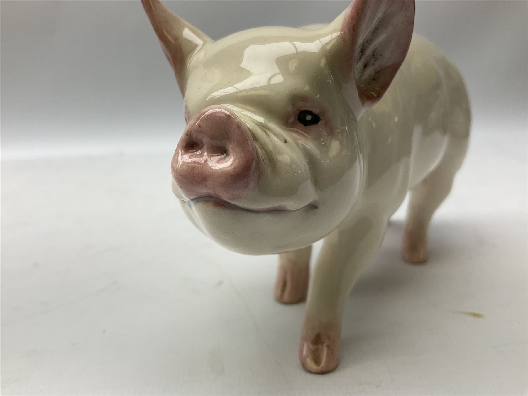 Collection of Beswick pig figures, to include John Beswick Little Likeables ‘Hide and Sleep’, white boar pig and John Beswick trio of pigs, all marked beneath (5)