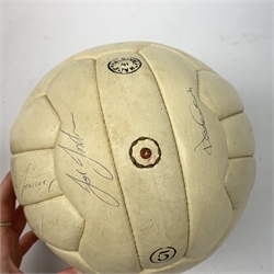 Leather football signed by various Leeds United players from the 1970s including Joe Jordan, Norman Hunter, Johnny Giles, Paul Reaney, Gordon McQueen, Peter lorimar, Eddie Gray, Trevor Cherry, Allan Clarke, Billy Bremner, Terry Yorath etc. 