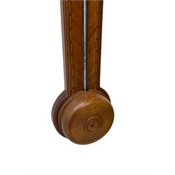 20th century - mercury cistern barometer in an 18th century style mahogany case with contrasting inlay and a broken pediment, round base with a turned cistern cover, fully exposed glass tube and silvered register within a glazed door, with a Fahrenheit spirit thermometer, engraved weather predictions and sliding vernier. Mercury clean and present.
