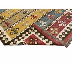Kilim rug, with multiple horizontal bands decorated with stylised geometric motifs