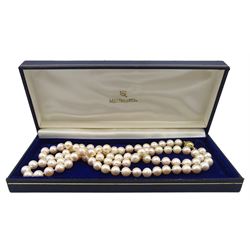 Single strand pearl necklace, eighty-three pink/peach cultured pearls, with 9ct gold ball clasp, maker's mark SP, Birmingham import mark 1989, in Mikimoto box with guarantee card