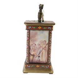 Late 20th century- Chinese 8-day timepiece carriage clock with Cloisonne work on a red ground to the four pillars, base and cornice, with painted porcelain panels to the sides, white enamel dial with Roman numerals and trefoil steel hands, platform escapement wound and set from the rear. With Key.