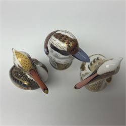 Three Royal Crown Derby paperweights, comprising Kookaburra, White Pelican and Brown Pelican, all with gold stopper, printed mark beneath and original box
