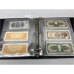 World banknotes, including Queen Elizabeth II The States of Jersey one pound 'DB202703', five pounds 'BB527762' and ten pounds 'AB651481', reserve bank of New Zealand two dollars '1L3 741894', King George V Straits Settlements one dollar 1st January 1935 'F/83 28924', various Bank of England notes etc, housed in two ring binder albums