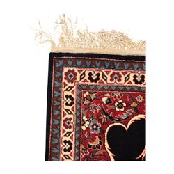 Persian-style wool rug, cream field with floral and geometric motifs, wide floral border (74cm x 142cm); Persian wool rug, beige field with dense floral patterns, narrow floral border (70cm x 144cm); Tribal wool rug, red and navy with diamond motifs (96cm x 60cm); Persian pictorial wool rug, black field with vase, birds, and floral border (70cm x 73cm)