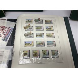Mostly Queen Elizabeth II Great Britain and Isle of Man stamps including mint examples, housed in various albums, stockbooks and loose, in one box