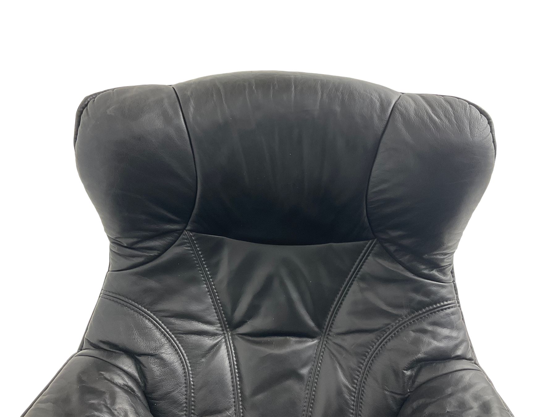 Anderssons of Sweden - mid-20th century design swivel armchair, upholstered black leather, raised on beech U-frame supports with circular base, together with matching footstool 